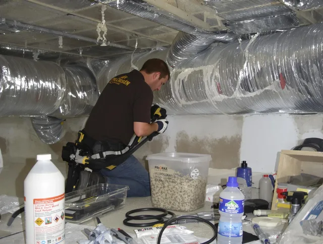 Somerset Air Duct Cleaning specialist performing professional mold removal from air ducts in Somerset