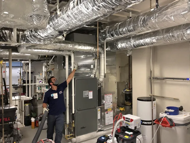 Somerset Air Duct Cleaning specialist performing thorough furnace duct cleaning in a Somerset residence
