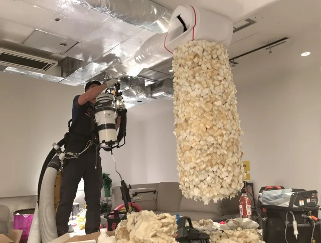 Somerset Air Duct Cleaning technician performing precision vacuum insulation removal in a residential property in Somerset