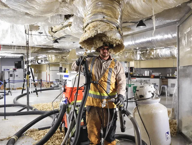 Professional vacuum insulation removal by Somerset Air Duct Cleaning expert in Somerset